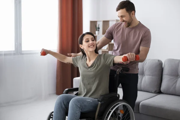 Support worker helping client indoors – 3Sixty5 Care